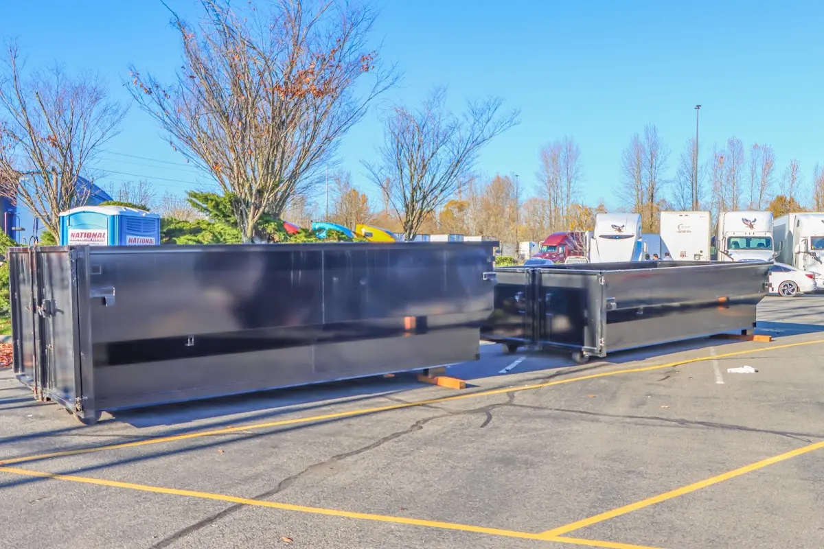 Professional dumpster rental service with roll-off container on residential driveway in Bardstown